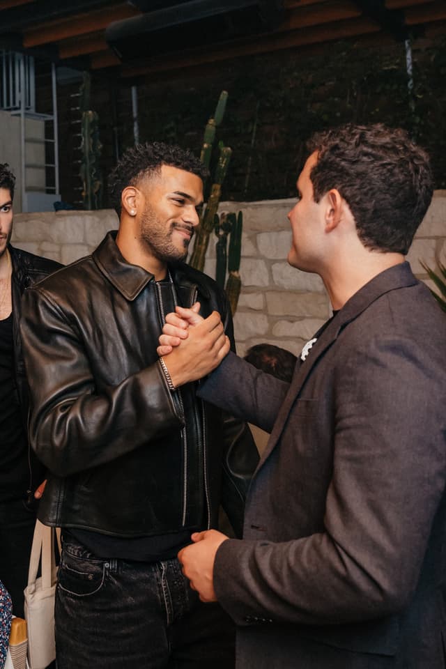 Guests greeting each other at a Bulletpitch event