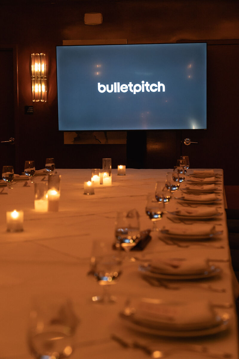 Candlelit table and Bulletpitch display at the October LA Influence Meets Venture dinner